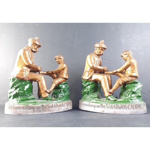 165 - A pair of ceramic figurines of 