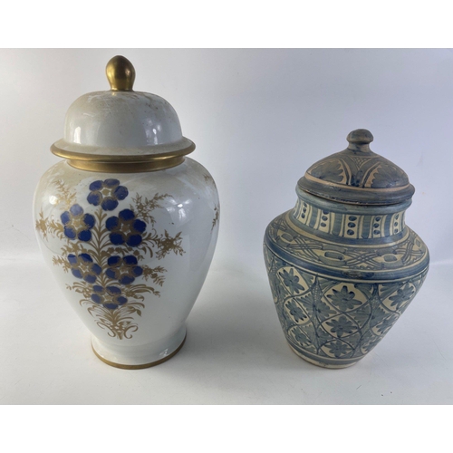 175 - Two large handpainted and DECORATIVE lidded jars, the larger one in porcelain dimensions 40cm tall x... 