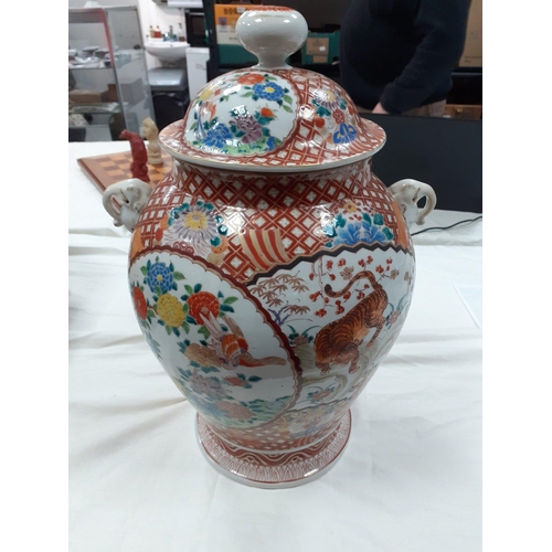 194 - A lovely large highly decorated oriental lidded ginger jar.  Stands 46cm high approx.  Has older rep... 