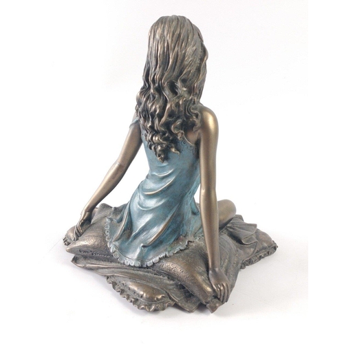 225 - A bronze effect statuette of a kneeling young woman in a negligee 16cm tall#48