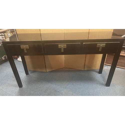 379 - A STYLISH ORIENTAL inspired long console table finished in a black lacquer paint with three drawers ... 