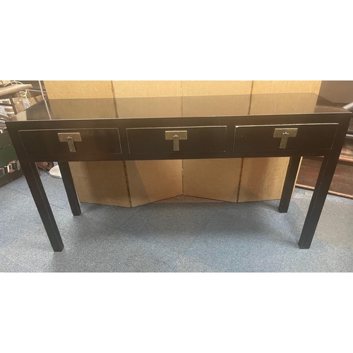 380 - A STYLISH ORIENTAL inspired long console table finished in a black lacquer paint with three drawers ... 