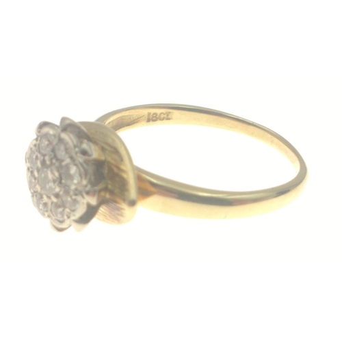 47 - DAZZLING DIAMONDS! 18ct stamped dress ring with eight diamonds and a larger centred diamond all in f... 