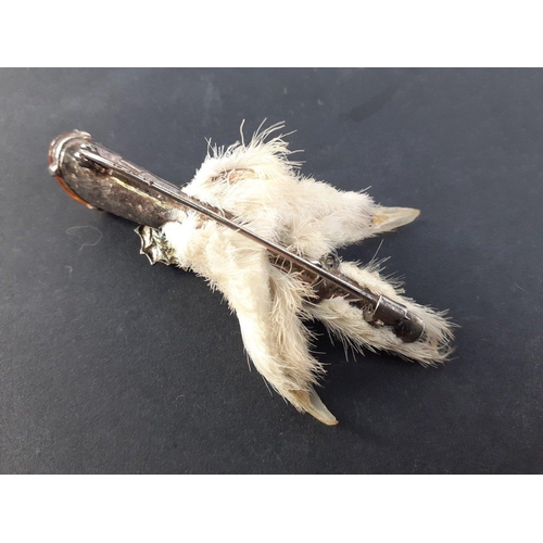 101 - VINTAGE SCOTTISH INTEREST! A mounted Ptarmigan Grouse claw with a Cairngorm in the end and an emboss... 