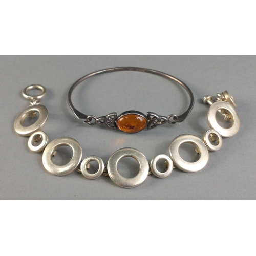 109 - Two 925 stamped bracelets one with amber coloured stone, the second a series of joined circles with ... 