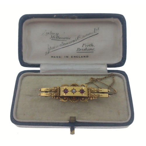 14 - A gorgeous 15ct stamped Victorian bar brooch set with a centre diamond and two garnets and with work... 