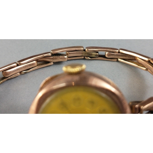 20 - A 9ct gold cased ladies cocktail watch.  9ct marks to centre bands of the bracelet.  Watch not curre... 