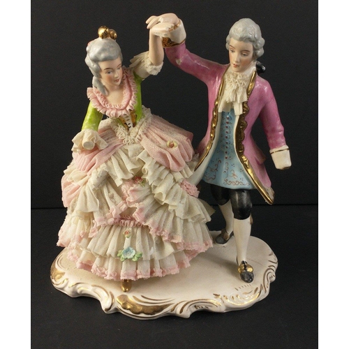 222 - A vintage German porcelain figurine of a lady with three greyhounds approx 23cm high.  There is dama... 