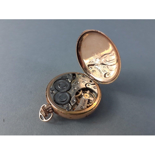 26 - A small gold filled cased SCW. Co. fob watch by LOCUST. Works with a gentle wind. 27mm dial approx. ... 