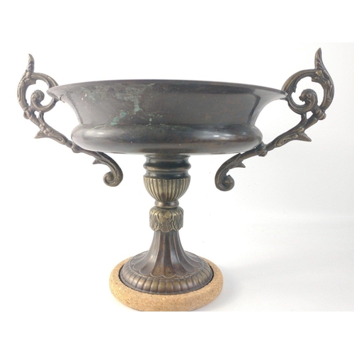 35 - A shallow two-handled brass fruit dish on a pedestal standing approx 20cm tall, dia 21cm approx#42... 