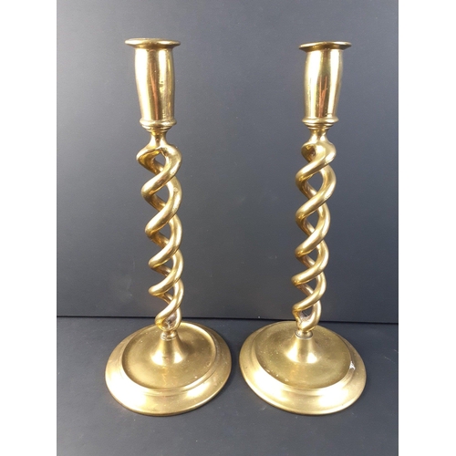 55 - A very nice pair of brass twist stem candlesticks standing 30cm high approx.#62