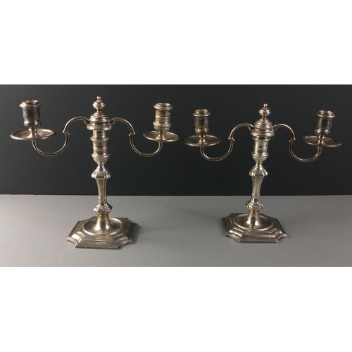 59 - QUALITY HALLMARKED SILVER - A pair of unweighted silver two branch candelabra,  hallmarked for Londo... 