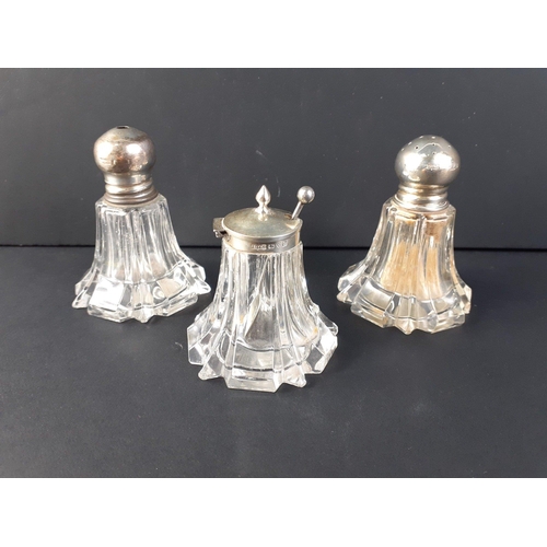 61 - A silver hallmarked cruet set, the pepper and mustard both marked for Chester 1939 made by James Dix... 