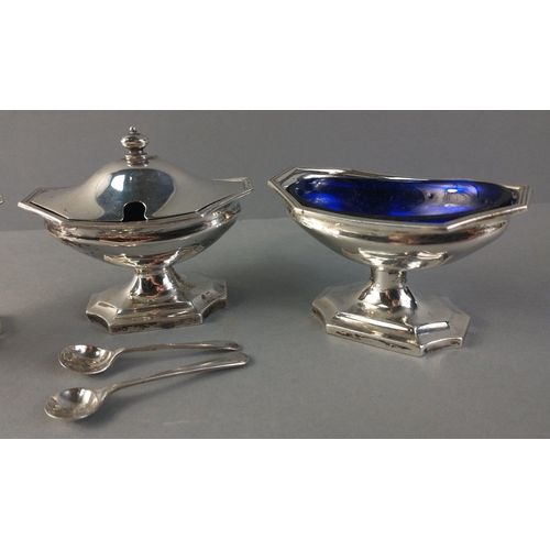 62 - Silver condiment set with lovely Bristol Blue glass liners and two condiment spoons.  London 1910. W... 