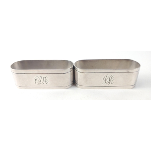 63 - A pair of Lewbury sterling silver napkin rings. Each stamped Dunklings 925 silver, gross weight 78.5... 