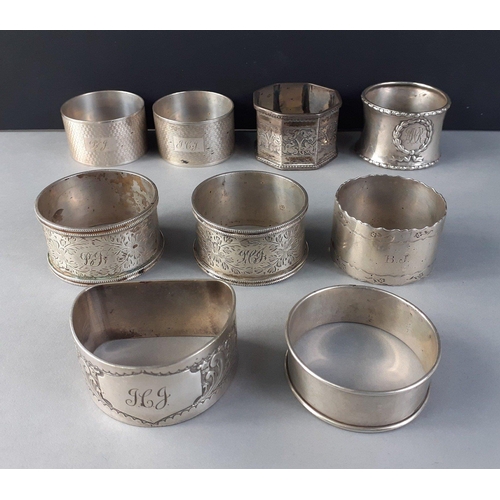 64 - A collection of 8 variously hallmarked napkin rings including by WALKER & HALL, weight 218g appr... 