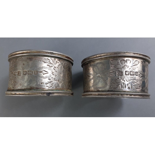 64 - A collection of 8 variously hallmarked napkin rings including by WALKER & HALL, weight 218g appr... 