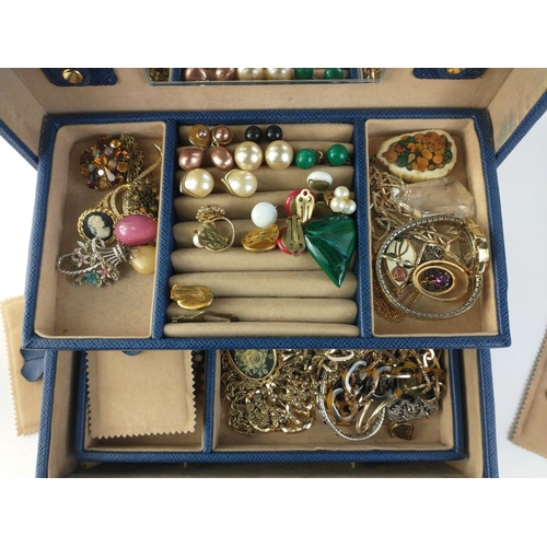 79 - A blue jewellery case, clasp not working, 27x18x14cm, containing costume jewellery to include earrin... 