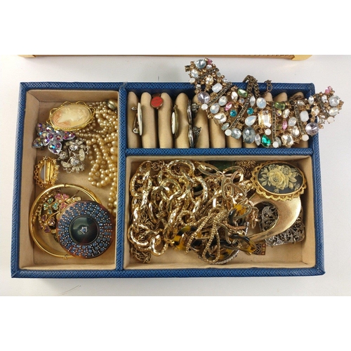 79 - A blue jewellery case, clasp not working, 27x18x14cm, containing costume jewellery to include earrin... 