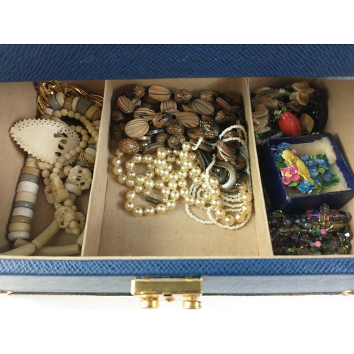 79 - A blue jewellery case, clasp not working, 27x18x14cm, containing costume jewellery to include earrin... 