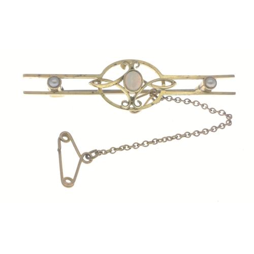 8 - 15ct stamped bar brooch with two seed pearls and a central small opal. Total gross weight 4.58g appr... 