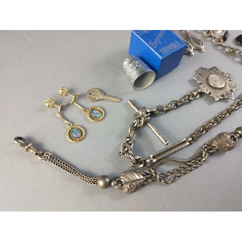 81 - A small bag of white metal jewellery to include 2 part chains, a STRATNOID thimble, and 2 pairs of e... 