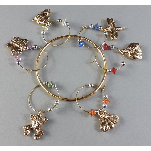 82 - Six assorted gilded bangle decorations depicting a snail, bee, frog etc on a gilded hook#89