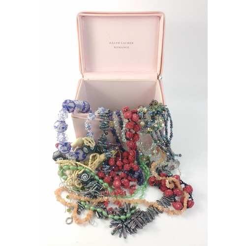 86 - A wee treasure trove of costume jewellery all within a Ralph Lauren pink Romance box.  Beads, bangle... 