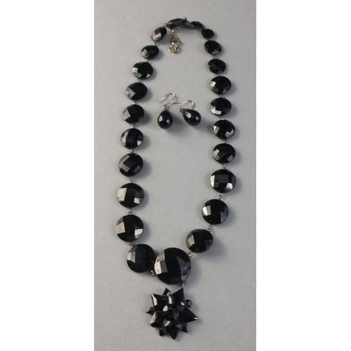 89 - A small size black stone, possible Jet necklace with drop earrings. 925 stamp to safety chain and 'N... 