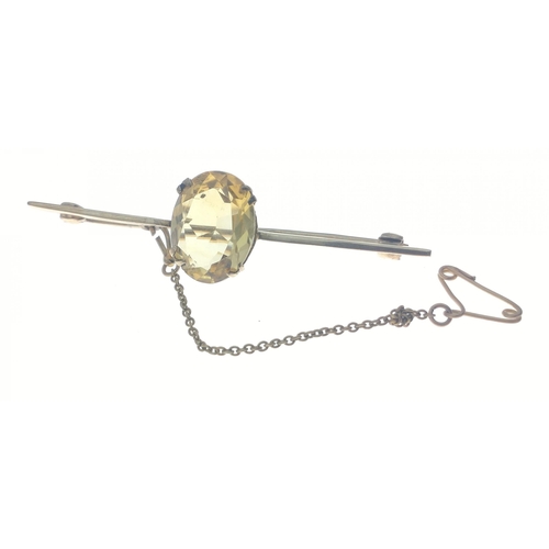 9 - 9ct marked vintage bar brooch with central citrine stone and safety chain.  Gross weight 5.38g appro... 