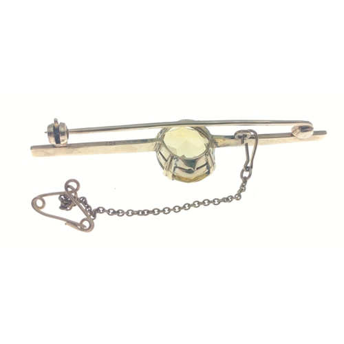 9 - 9ct marked vintage bar brooch with central citrine stone and safety chain.  Gross weight 5.38g appro... 