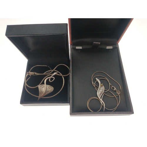 91 - Two silver hallmarked necklaces in presentation boxes.  Total gross weight 18g approx#100