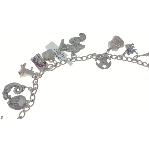 93 - Silver charm necklet with multiple charms.  Total gross weight 91g approx.#102