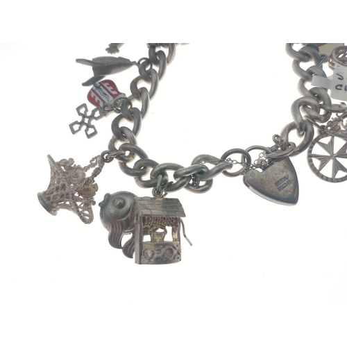 96 - Silver charm bracelet with multiple world charms of interest. Total gross weight 83g approx#105