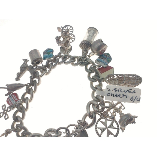 96 - Silver charm bracelet with multiple world charms of interest. Total gross weight 83g approx#105