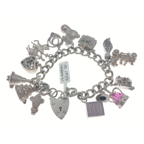 98 - Silver charm bracelet with multiple charms many articulated. Total gross weight 86.5g approx.#107... 