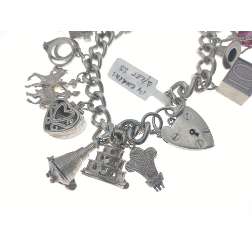 98 - Silver charm bracelet with multiple charms many articulated. Total gross weight 86.5g approx.#107... 