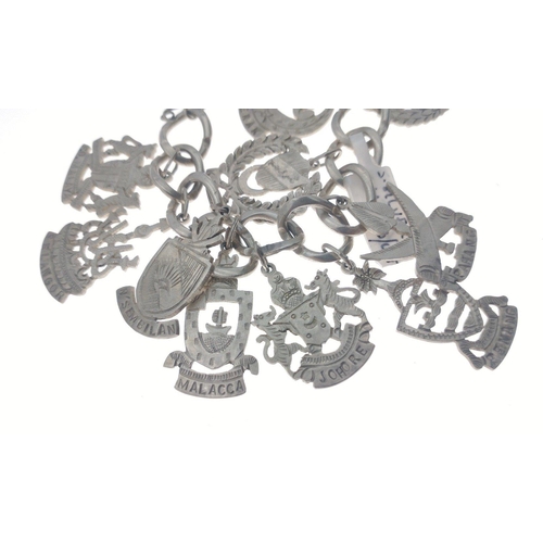 99 - Silver charm bracelet with continental fobs. Total gross weight 63.5g approx#108