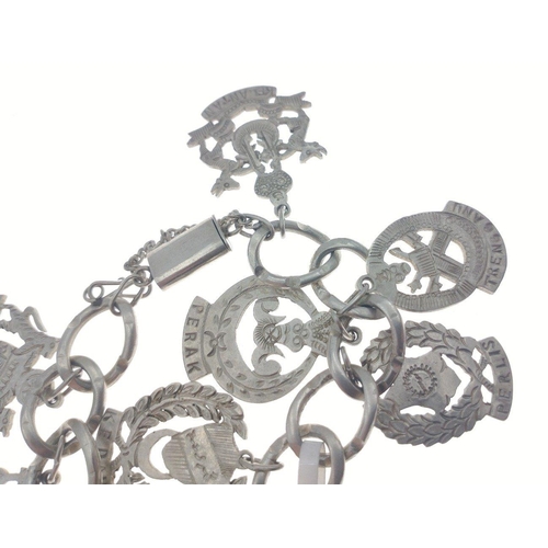 99 - Silver charm bracelet with continental fobs. Total gross weight 63.5g approx#108