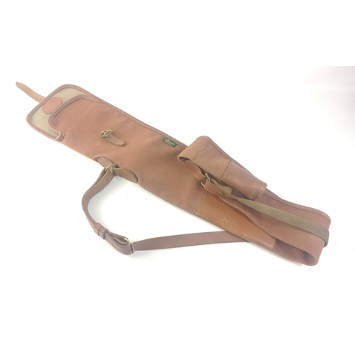 127 - A BRADY of HALESOWEN leather and canvas Shotgun Case in good useable condition complete with shoulde... 