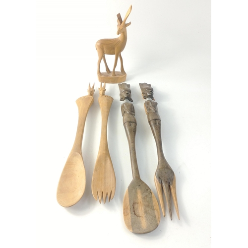 227 - Two pairs of wooden African salad servers one pair with antelopes (33cm long), the other with stern ... 