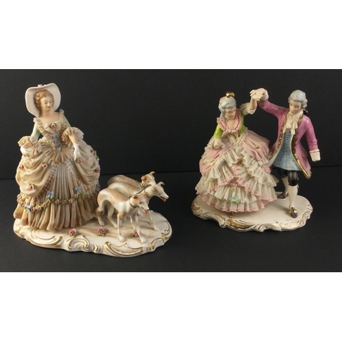 236 - A vintage German porcelain figurine of a lady with three greyhounds approx 23cm high.  There is dama... 