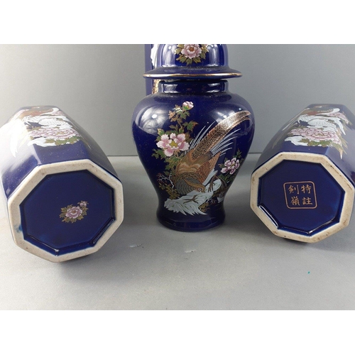 266 - A small collection of five Oriental cobalt blue pheasant vases to include two matching 21cm vases, a... 