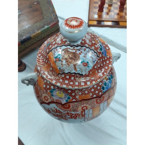 270 - A lovely large highly decorated oriental lidded ginger jar.  Stands 46cm high approx.  Has older rep... 