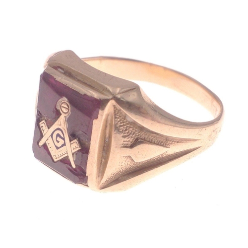 3 - A 10K yellow gold gent's MASONIC ring square red-stoned base (chipped) size V, gross weight 5.63 g#2... 