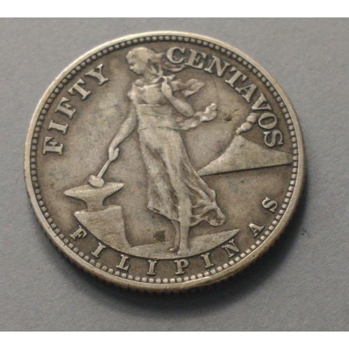 43 - An unusual coin of numismatic interest.  A 1944  PHILIPPINES silver 50 centavos coin. Nice coin with... 