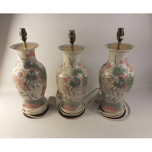 460 - Three substantial, floral table lamps with attractive heron motif, each 38cm high#152