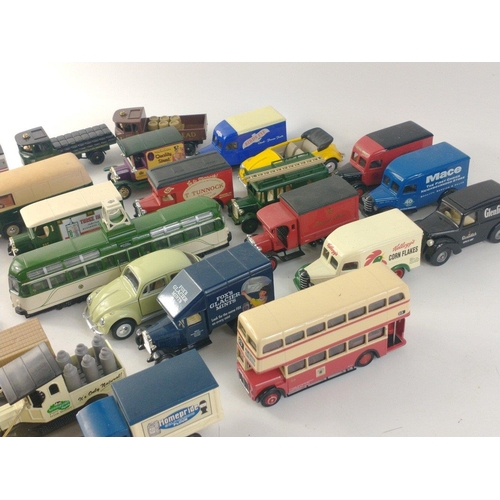 184 - A box of Diecast models to include many CORGI buses and trams as well as some Lledo models.#198