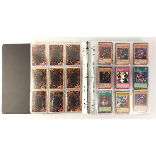 187 - A folder of KONAMI YU-GI-OH! trading cards includes 38 sheets each of 9 cards#201