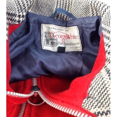 274 - A vintage size 10, zip-up cape in red wool with houndstooth collar and pocket trim and blue lining, ... 